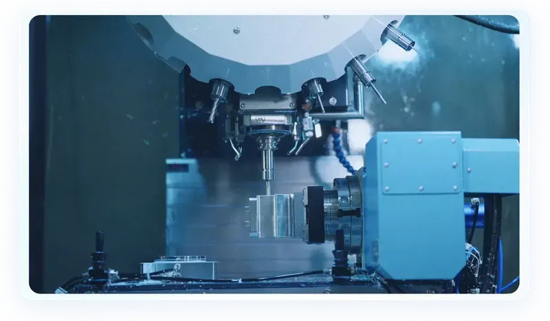 Five-axis CNC machining centre milling a complex metal part