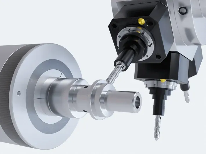 CNC lathe turning a cylindrical metal component